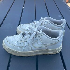 Youth Nike Air Force 1. White sneaker with stylish platform midsole. Size 5Y